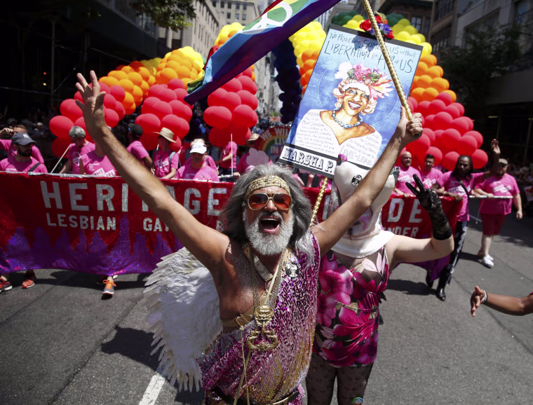 Image: People take part in the annual NYC Pride parade in New York City
