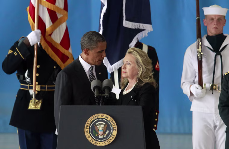 Image: U.S. President Obama and Secretary of State Clinton deliver remarks during a transfer ceremony of the remains of U.S. Ambassador to Libya, Chris Stevens and three other Americans killed this week in Benghazi, at Andrews Air Force Base near Washingt