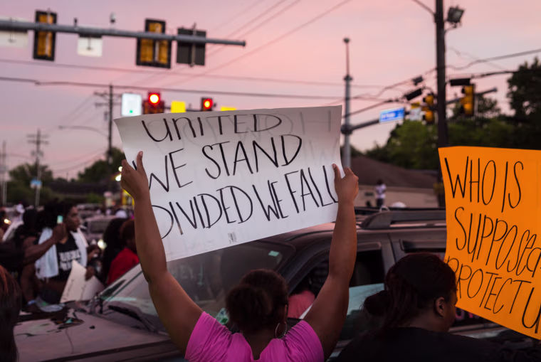 Image: People protest against the police shooting of Alton Sterling