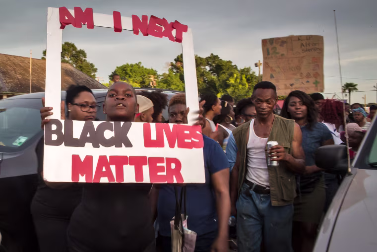 Image: People protest against the police shooting of Alton Sterling