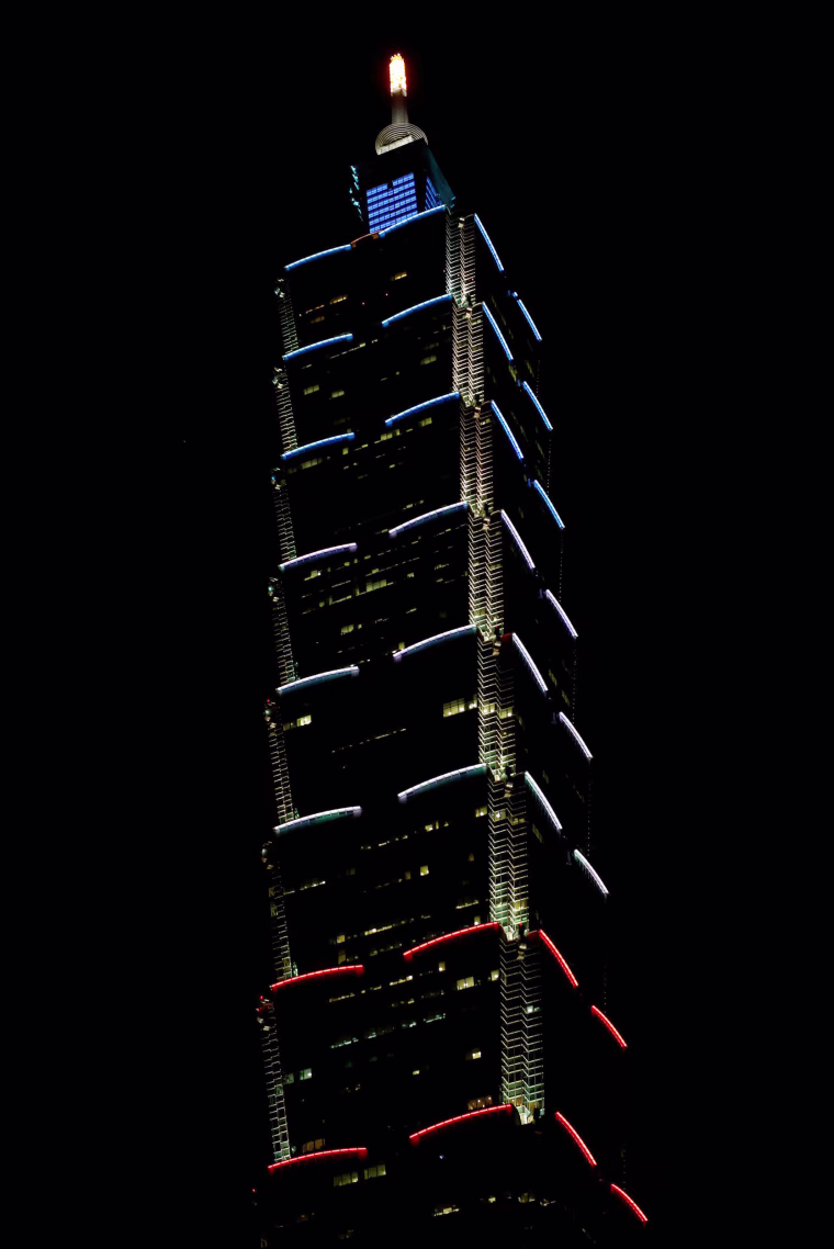 Image: Taiwan's landmark building Taipei 101 is lit up in the colours of the French flag