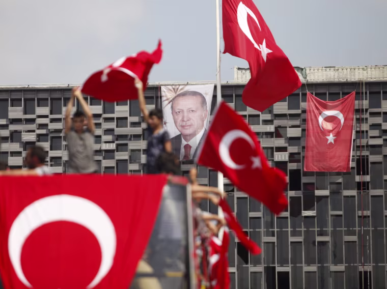 Image: A portrait of Turkish President Erdogan hangs on a building in Istanbul