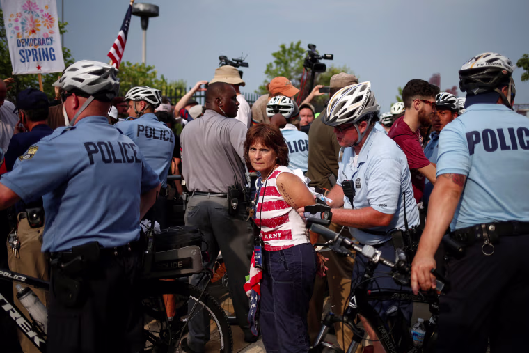 Image: An activist is arrested outside the site of the 2016 Democratic National Convention in Philadelphia, Pennsylvania