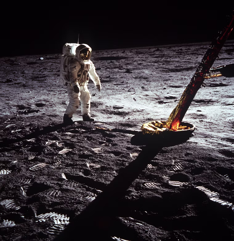 Astronaut Edwin E. Aldrin Jr., lunar module pilot, walks on the surface of the moon near a leg of the Lunar Module during the Apollo 11 extravehicular activity (EVA). Astronaut Neil A. Armstrong, Apollo 11 commander, took this photograph with a 70mm lunar surface camera. The astronauts' bootprints are clearly visible in the foreground. While astronauts Armstrong and Aldrin descended in the Lunar Module (LM) "Eagle" to explore the Sea of Tranquility region of the moon, astronaut Michael Collins, command module pilot, remained with the Command and Service Modules (CSM) "Columbia" in lunar orbit (Photo Credit: NASA).