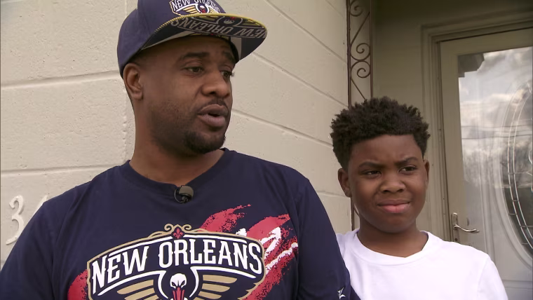 New Orleans resident Quinn Bourgeois stands next to his son, Quinn, 11. Tests conducted by NBC News on the family's kitchen tap found that lead levels increased as the water ran. "It seems like after two minutes of running your water, it's still leveling up higher and higher," Bourgeois said.