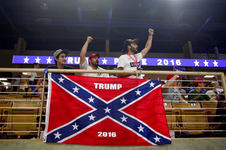Image: Brandon Miles, Brandon Partin and Michael Miles cheer before Republican U.S. presidential nominee Donald Trump attends a campaign rally at the Silver Spurs Arena in Kissimmee, Florida