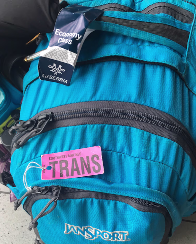 A photo of trans activist Hannah Simpson's backpack taken in August 2016. Just for fun, she ripped the "FER" off a Southwest Airlines "TRANSFER" tag and travels with it everywhere.