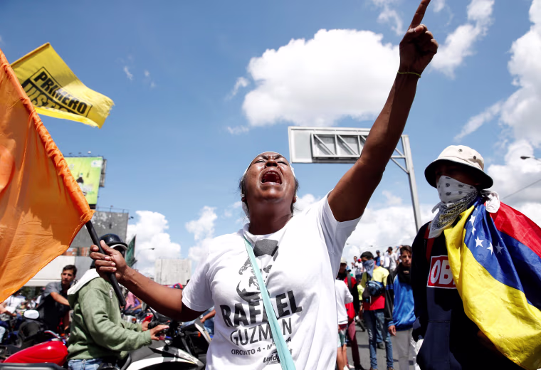 Protesters yell slogans during a rally to demand a referendum to remove Venezuela's President Nicolas Maduro in Caracas, Venezuela