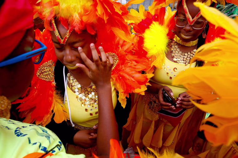 Image: Participants are seen during the West Indian Day Parade in the Brooklyn borough of New York