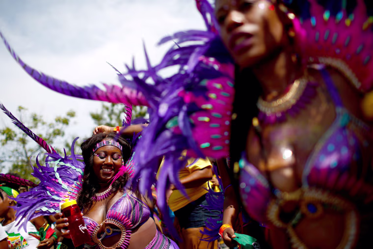 Image: Participants dance during the West Indian Day Parade in the Brooklyn borough of New York