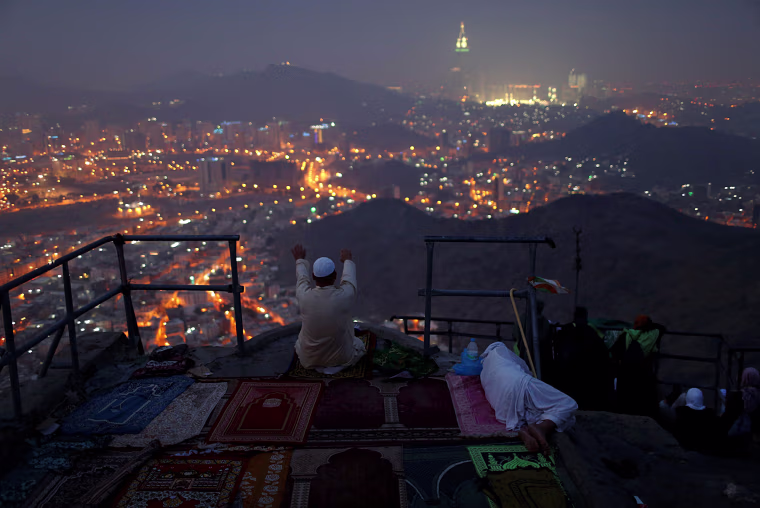 Image: A pilgrim prays at Mount Al-Noor ahead of the annual haj pilgrimage in the holy city of Mecca