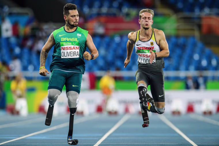 Image: Brazil's Alan Fonteles Cardoso Oliveira and Germany's Johannes Floors compete during a heat of men's 100-meter