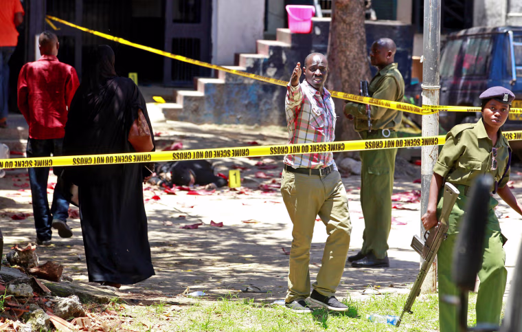 Image: Police officers and explosive experts secure the central police station after an attack, in the coastal city of Mombasa