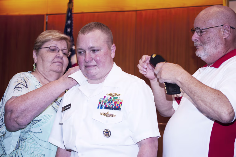 Navy Lt. Cdr. Blake Dremann with his parents Rev. Dr. Dave Dremann and Mrs. Diane Dremann