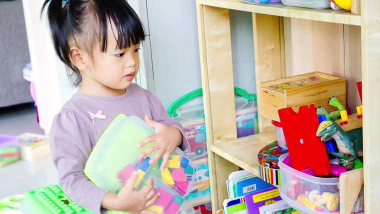 little girl with toys