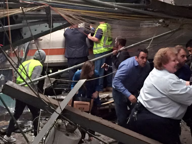 Image: Passengers rush to safety after a NJ Transit train crashed into the platform at the Hoboken Terminal
