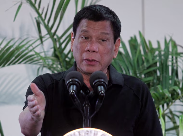 Image: Philippines President Rodrigo Duterte gestures during a news conference upon his arrival from Vietnam trip at the International Airport in Davao city