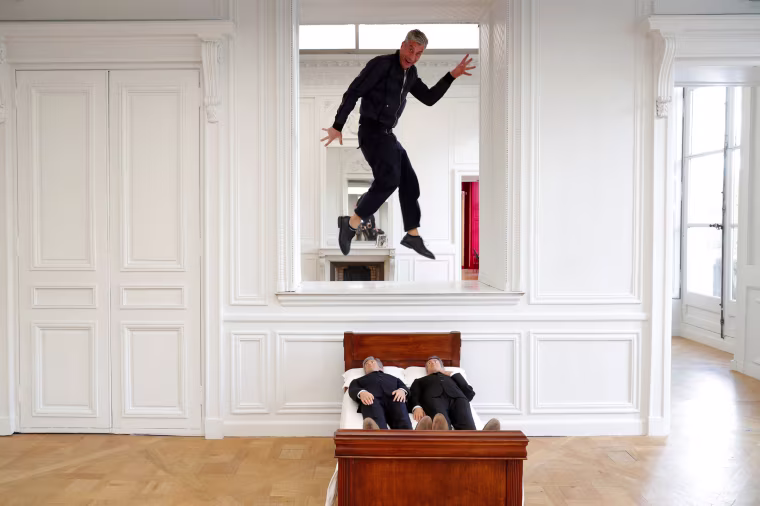 Image: Italian artist Maurizio Cattelan poses with his creation \"Is There Life Before Death\" in Paris