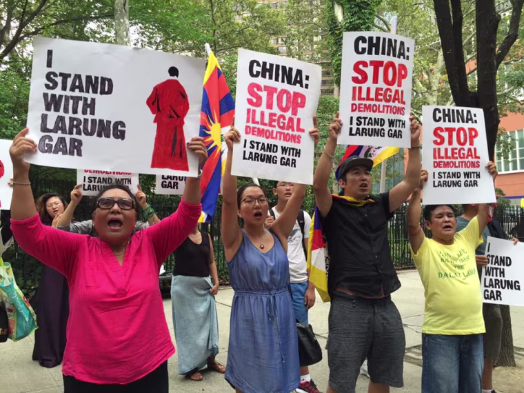 Members of the Tibetan community, Students for a Free Tibet, and Tibetan Youth Congress show their support for Larung Gar outside the Chinese Mission to the United Nations in New York City in a photo dated Aug. 10, 2016.