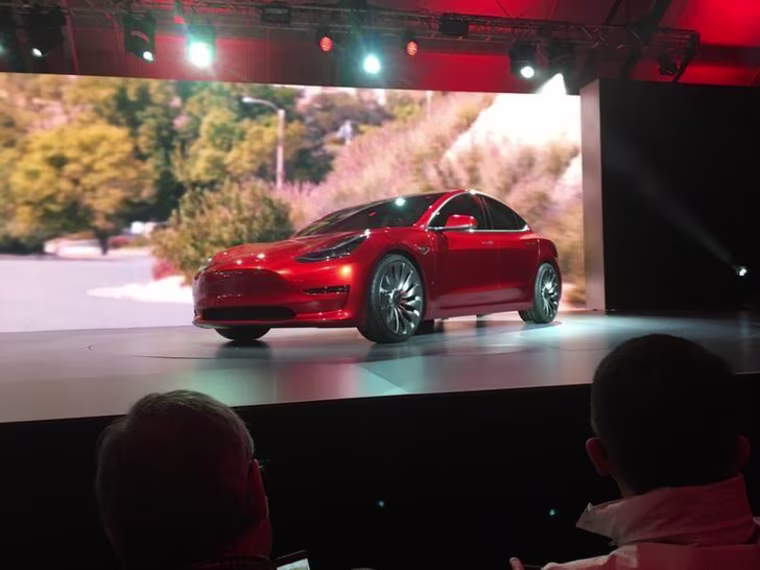 A Tesla Model 3 sedan, its first car aimed at the mass market, is displayed during its launch in Hawthorne
