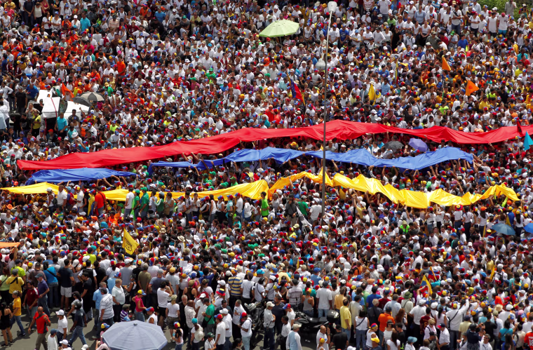 Image: Opposition supporters take part in a rally against Venezuela's President Nicolas Maduro's government in Caracas