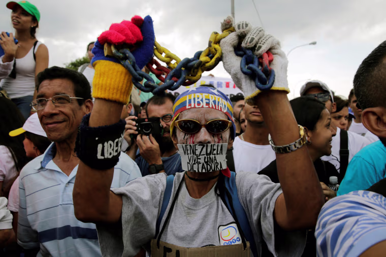 Image: Opposition supporters take part in a rally against Venezuela's President Nicolas Maduro's government in Caracas