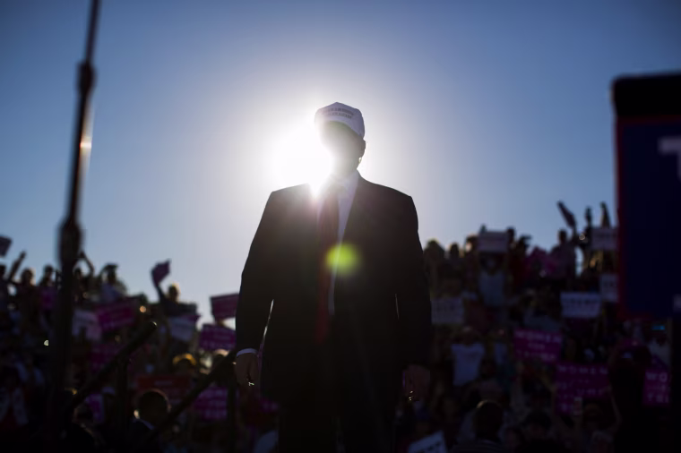 Image: Donald Trump arrives to speak to a campaign rally in Naples