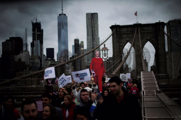 Image: Supporters of U.S. Democratic presidential nominee Hillary Clinton take part in a march through the Brooklyn bridge in New York