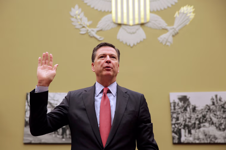 Image: FBI Director Comey is sworn in before testifying before a House Judiciary Committee hearing on "Oversight of the Federal Bureau of Investigation" on Capitol Hill in Washington