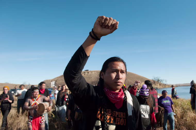 Image: People protest against the building of a pipeline on the Standing Rock Indian Reservation near Cannonball, North Dakota