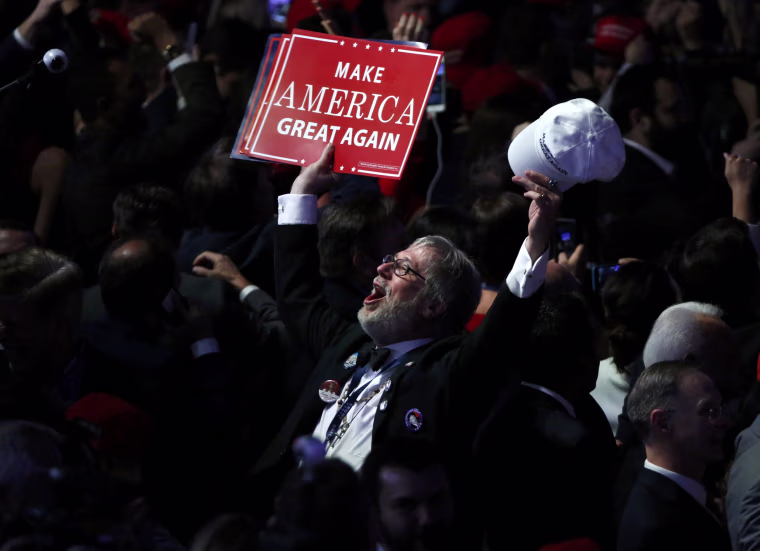 Image: A Trump supporter celebrates as election returns come in at Republican U.S. presidential nominee Donald Trump's election night rally in New York