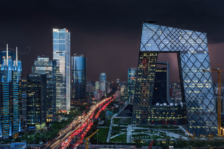 Image: The CCTV Tower, right, and other skyscrapers and high-rise office buildings in Beijing