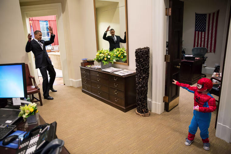 President Obama pretends to be caught in Spider-Man's web as he greets Nicholas Tamarin, 3, just outside the Oval Office on Oct. 26, 2012. Spider-Man had been trick-or-treating for an early Halloween with his father, White House aide Nate Tamarin in the Eisenhower Executive Office Building. \"I can never commit to calling any picture my favorite, but the president told me that this was HIS favorite picture of the year when he saw it hanging in the West Wing a couple of weeks later.\"