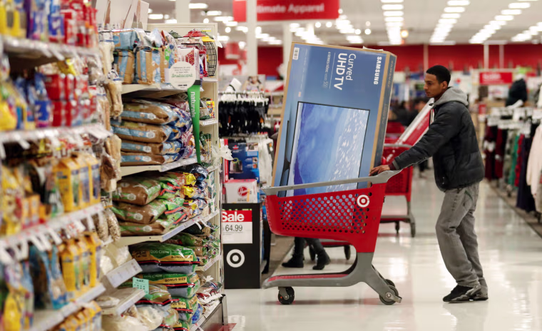 Image: Customer pushes his shopping cart during the Black Friday sales event on Thanksgiving Day at Target in Chicago