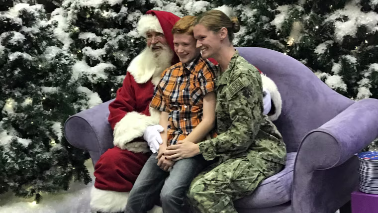 Military mom surprises son during visit to Santa.
