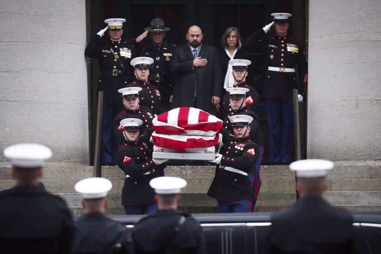 Image: The casket of John Glenn is carried out of the Ohio Statehouse by Marines during his funeral procession, Dec. 17, in Columbus, Ohio.