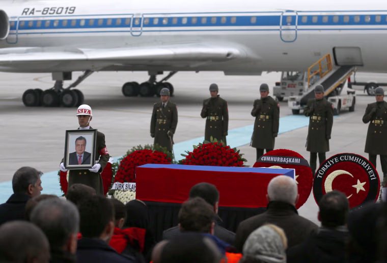 Image: The flag-wrapped coffin of late Russian Ambassador to Turkey Andrei Karlov is carried to a plane during a ceremony at Esenboga airport in Ankara, Turkey, Dec. 20, 2016.