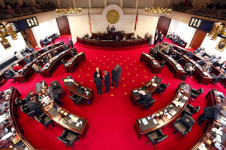 Image: Lawmakers confer during a negotiations on the floor of North Carolina's State Senate chamber as they meet to consider repealing the controversial HB2 law limiting bathroom access for transgender people in Raleigh, North Carolina