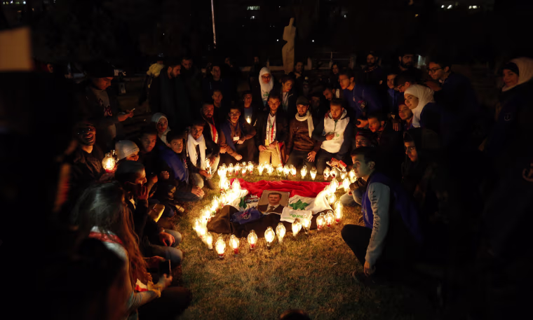 Image: Syrians during a vigil at the Ummayyad Square