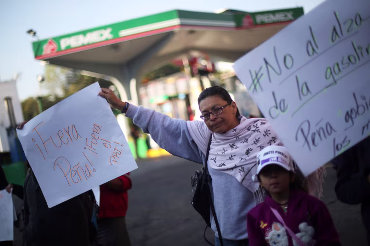 Image: Protesters block the entrance to a gas station as they take part during a demonstration against the rising prices of gasoline enforced by the Mexican government at Tlalpan Avenue in Mexico City on Jan. 3.