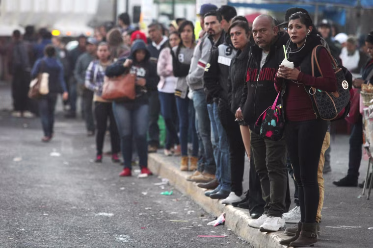 Image: Citizens walk towards their workplaces due to a transport strike in result of protests against the increase of the gasoline prices in Guadalajara, Mexico on Jan. 4.