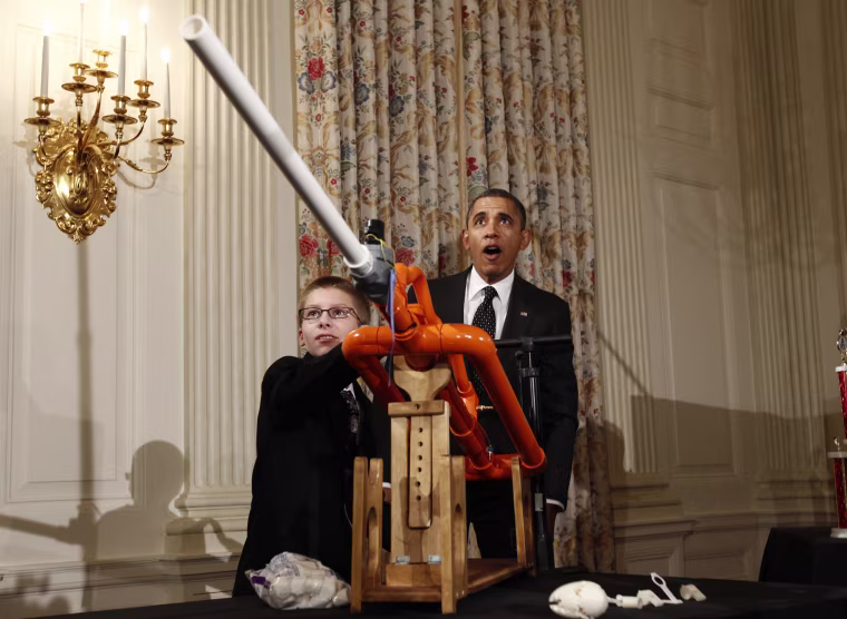 Image: U.S. President Obama reacts as Hudy launches a marshmallow from his Extreme Marshmallow Cannon during the second White House Science Fair in Washington