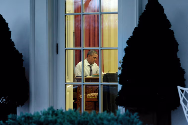 Image: President Barack Obama works on a draft of his State of the Union address