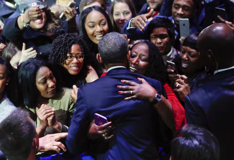 Image: President Obama is embraced by a woman in the crowd as he greets supporters after his farewell address at McCormick Place in Chicago on Jan. 10.