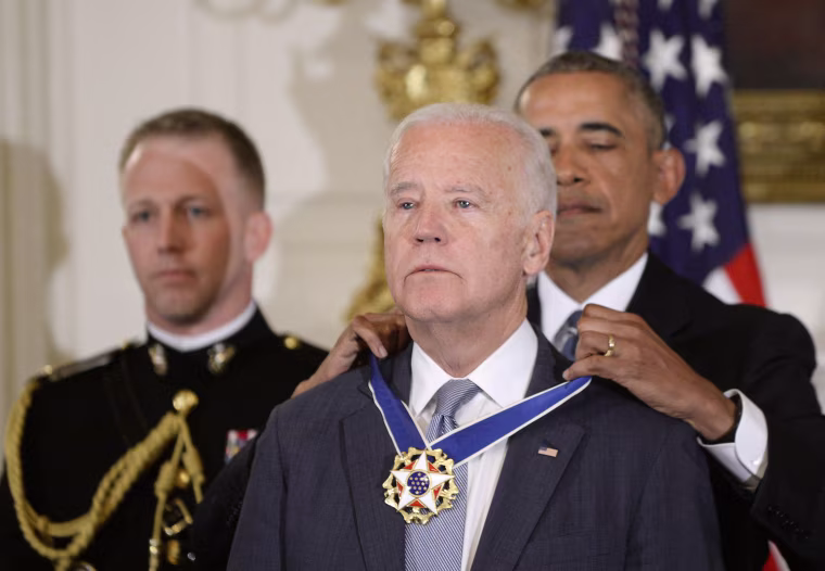 Image: President Barack Obama (R) presents the Medal of Freedom to Vice-President Joe Biden during an event in the State Dinning room of the White House, on Jan. 12, 2017 in Washington, D.C.