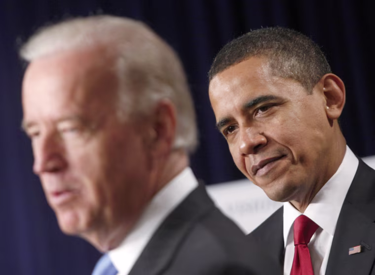 U.S. President Barack Obama listens to Vice-President Joe Biden make remarks on a proposed high-speed rail system in the Eisenhower Executive Office Building in Washington