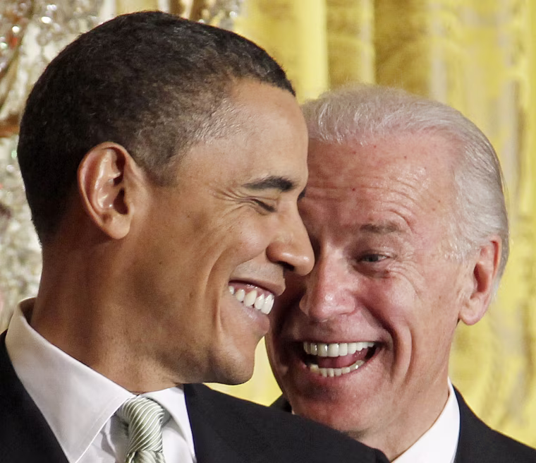 Image: U.S. President Barack Obama reacts to remarks by Vice President Joe Biden as Irish Prime Minister Brian Cowen (not pictured) speaks at a St Patrick's Day reception in the East Room of the White House in Washington, March 17, 2010.