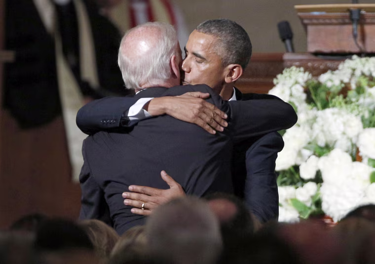 Image: U.S. President Barack Obama kisses Vice President Joe Biden on the cheek as he hugs him after delivering the eulogy during the funeral of Biden's son, former Delaware Attorney General Beau Biden, at St. Anthony of Padua church in Delaware.