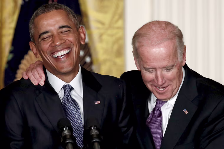 Image: U.S. Vice President Joe Biden interjects as President Barack Obama delivers remarks at a reception for the 25th anniversary of the White House Initiative on Educational Excellence for Hispanics at the White House in Washington, Oct. 15, 2015.