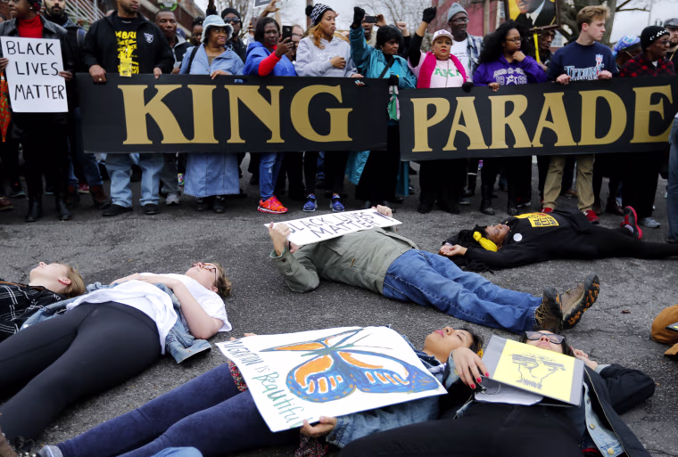 Image: Supporters of the Black Lives Matter movement stage a \"die in\" outside the National Civil Rights Museum following the annual Martin Luther King Day march on Jan. 16, 2017 in Memphis, Tennessee.